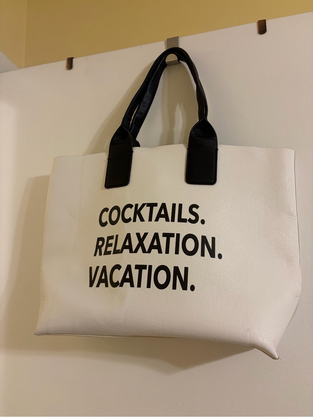 White Tote Bag with Black Handles and Bold Black Text